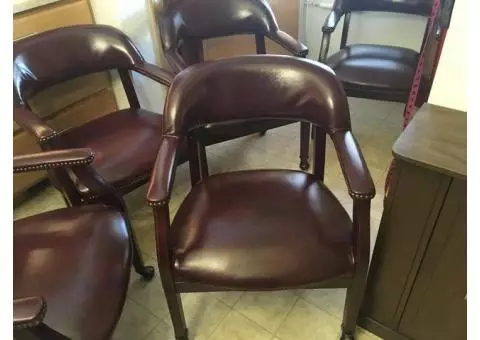 5 maroon ‘leather’ dining or office chairs.